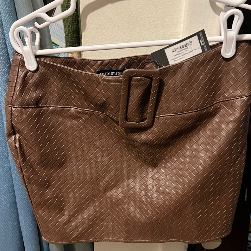 NWT chocolate brown Woven Faux leather skirt with belt.